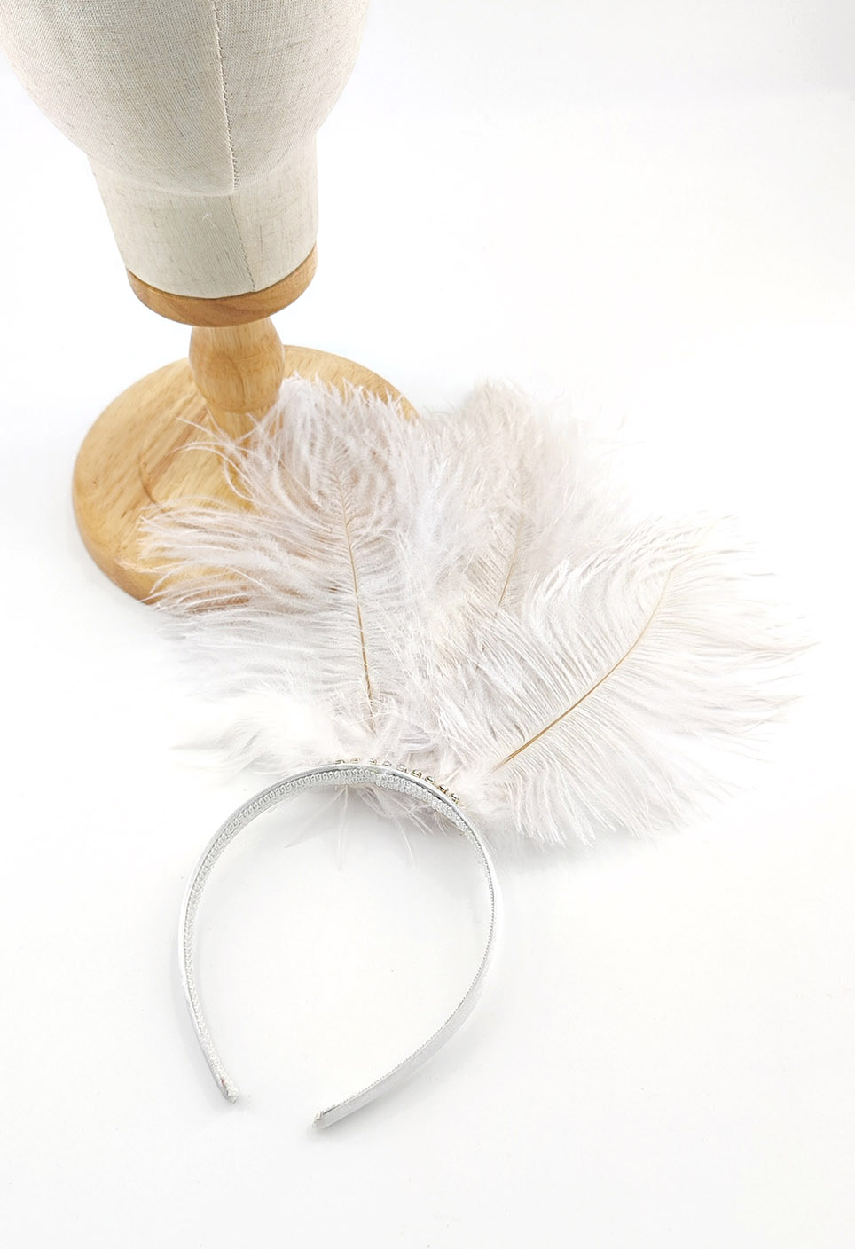 serre tete plume autruche blanc