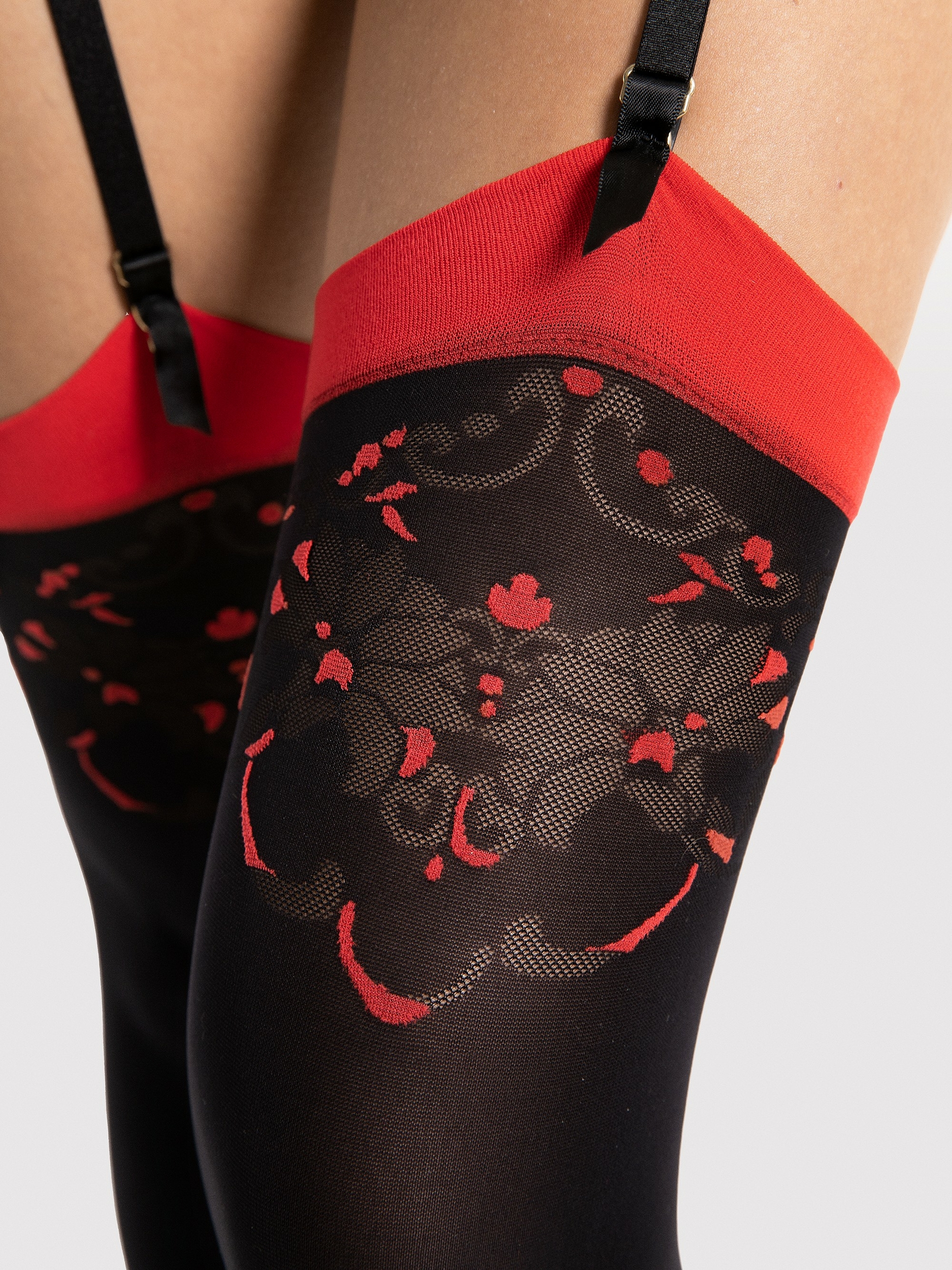 collant noir avec motif rouge