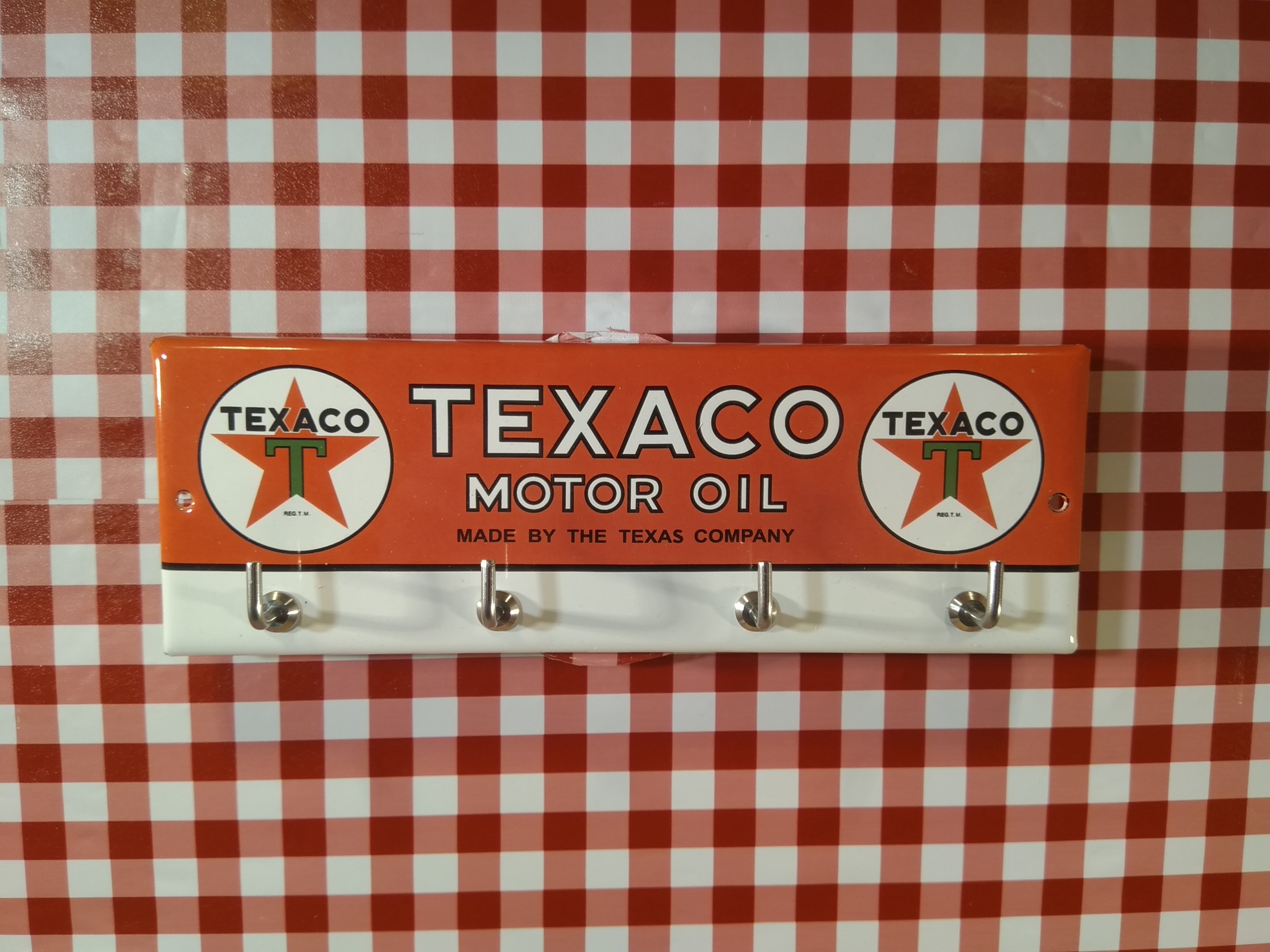 accroche clé émaillé publicitaire texaco