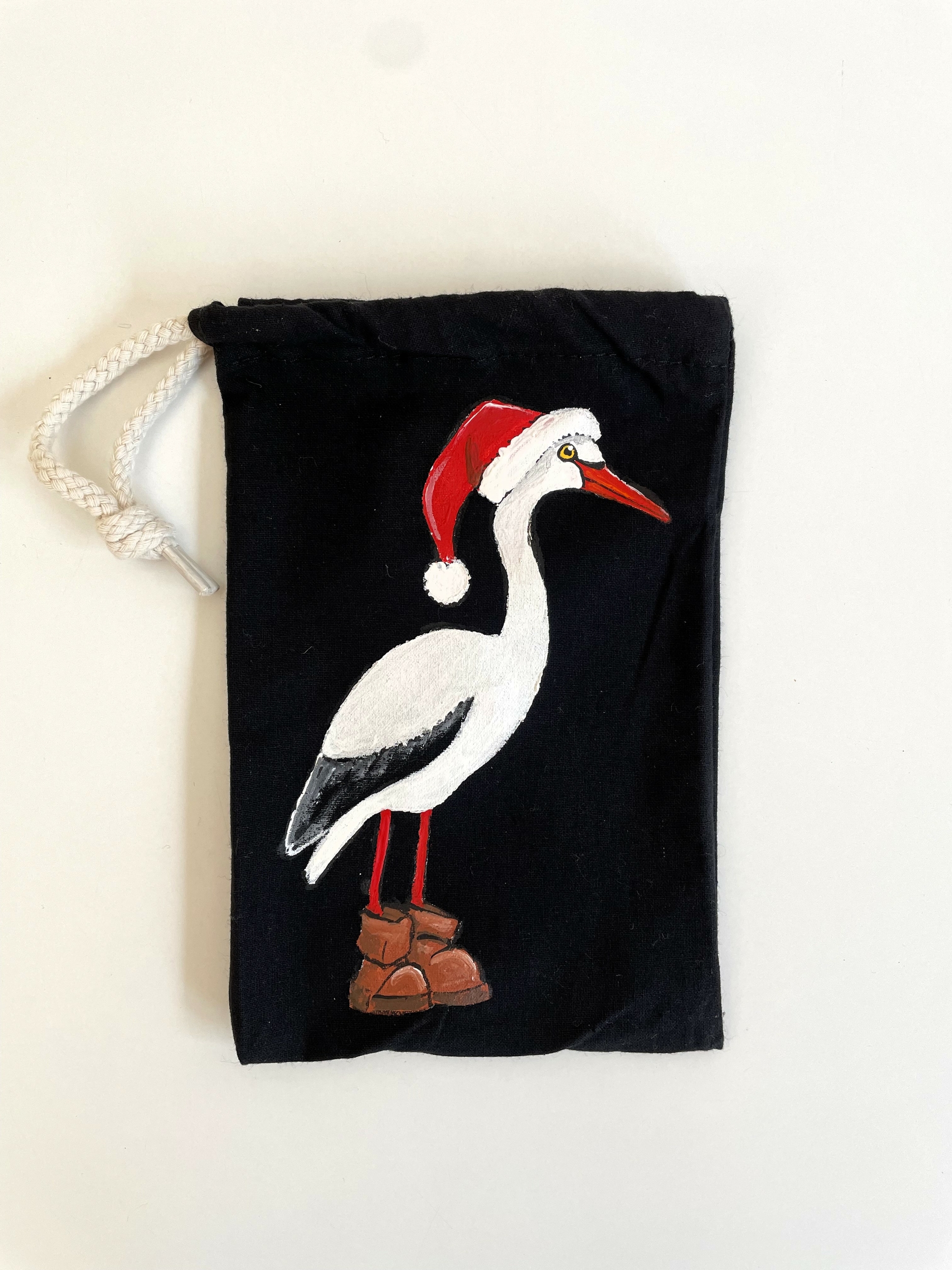 pochon noir cigogne de Noël peinte main  par Elles et No.