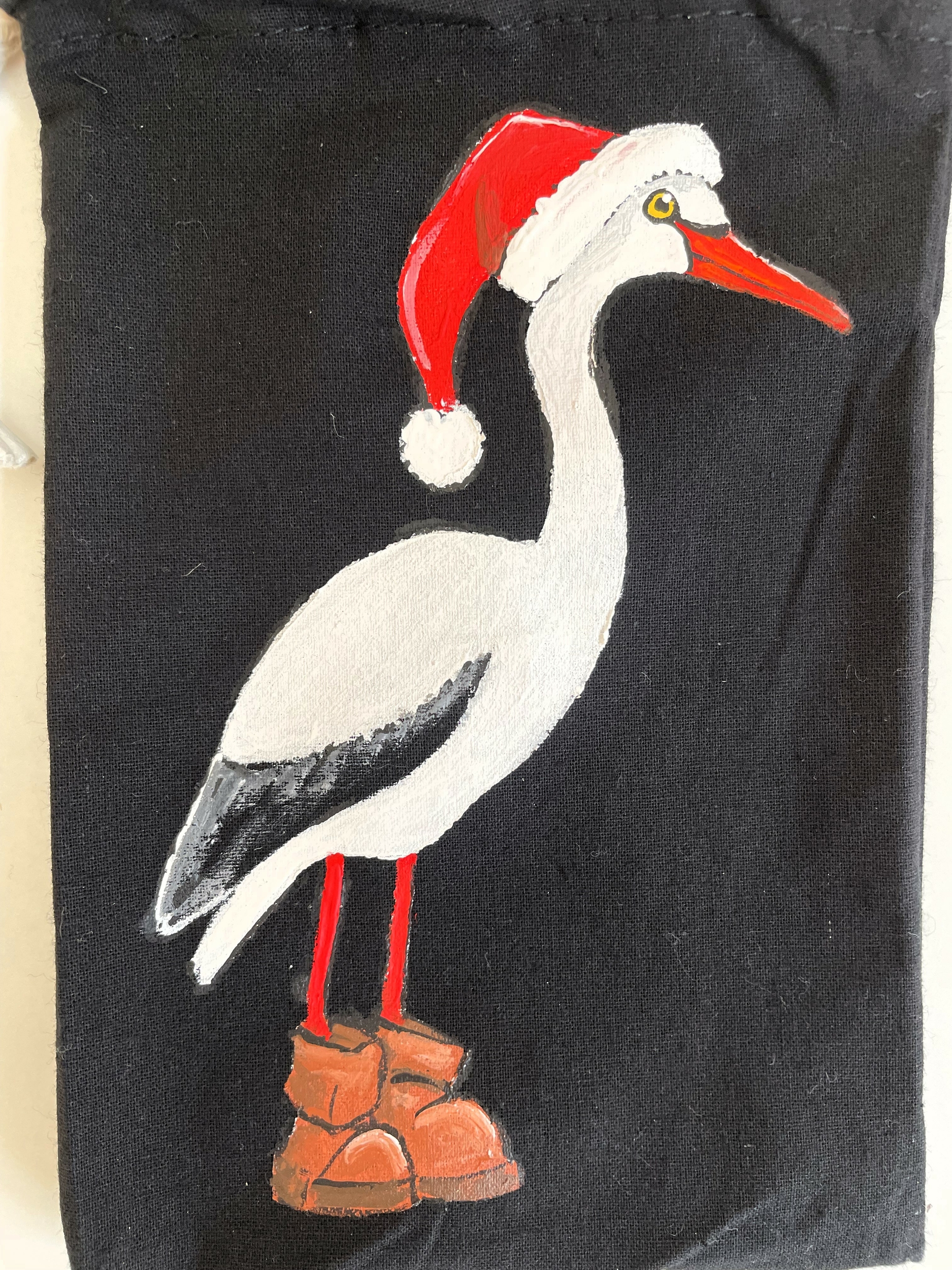 pochon noir cigogne de Noël peinte main  par Elles et No.