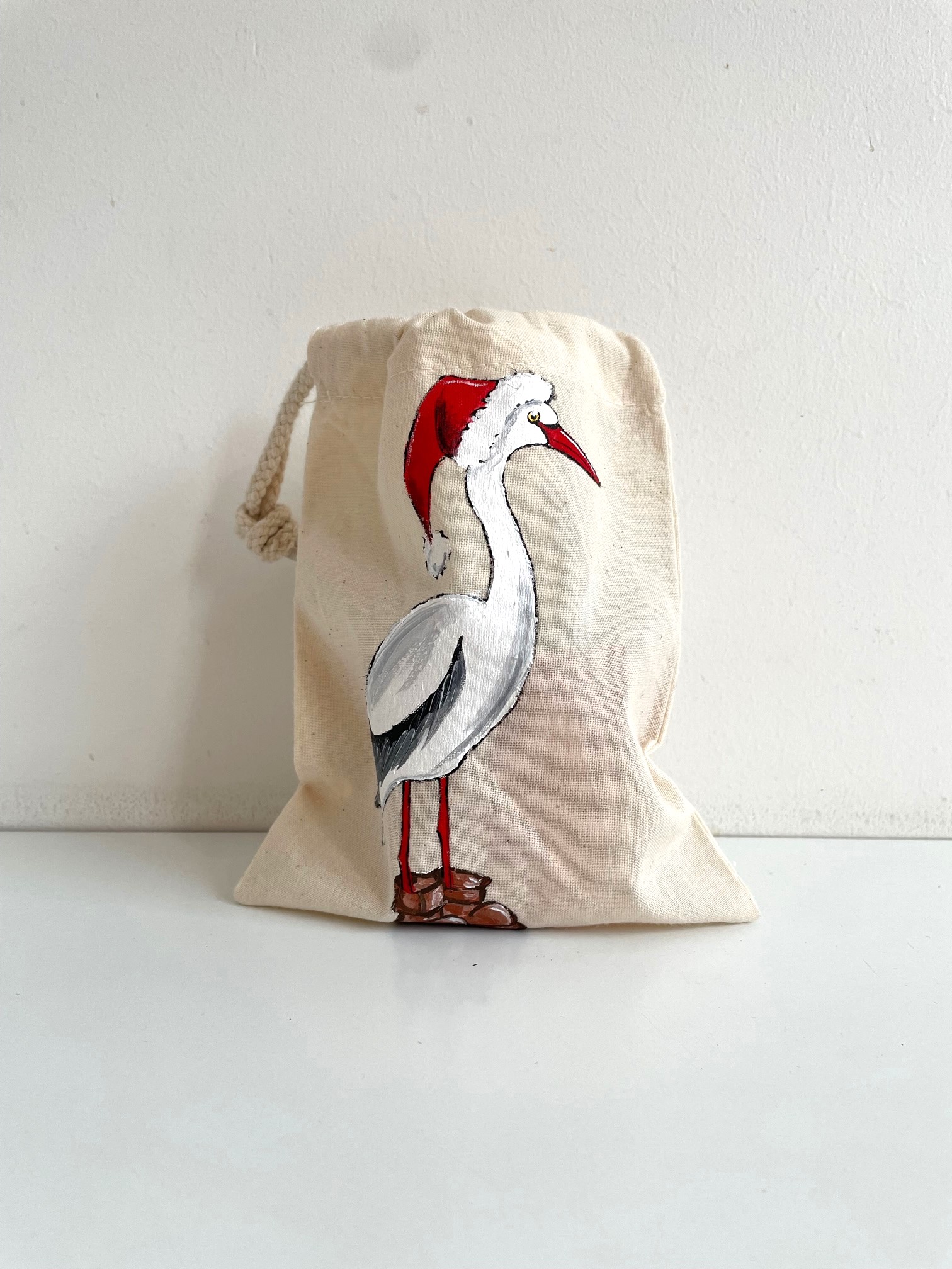 Pochon coton beige cigogne père noël peinte à  la main par Elles et No.
