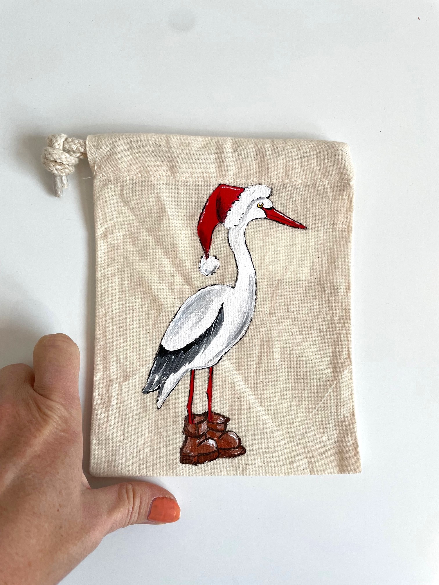 Pochon coton beige cigogne père noël peinte à  la main par Elles et No.