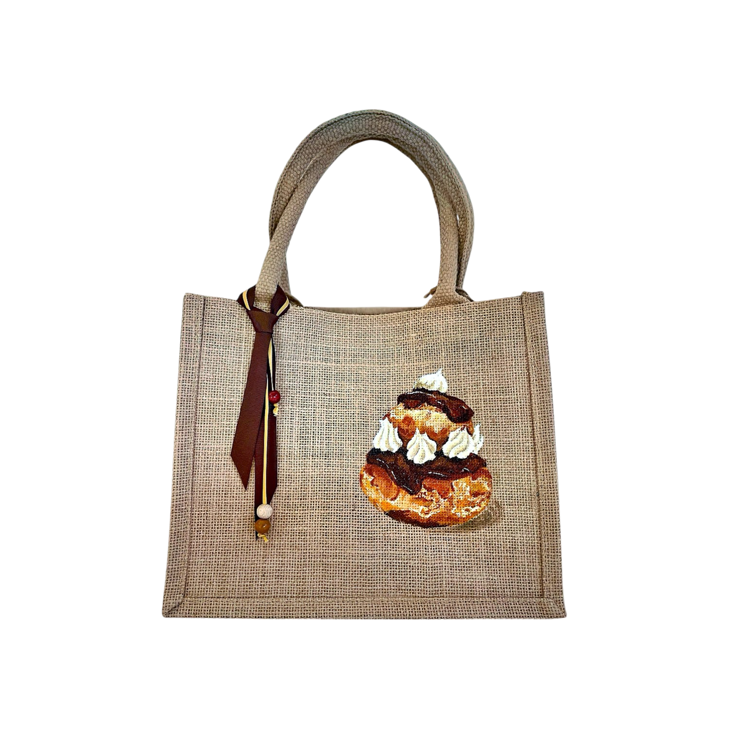 sac en jute avec une religieuse au chocolat peinte à la main par Elles et No.