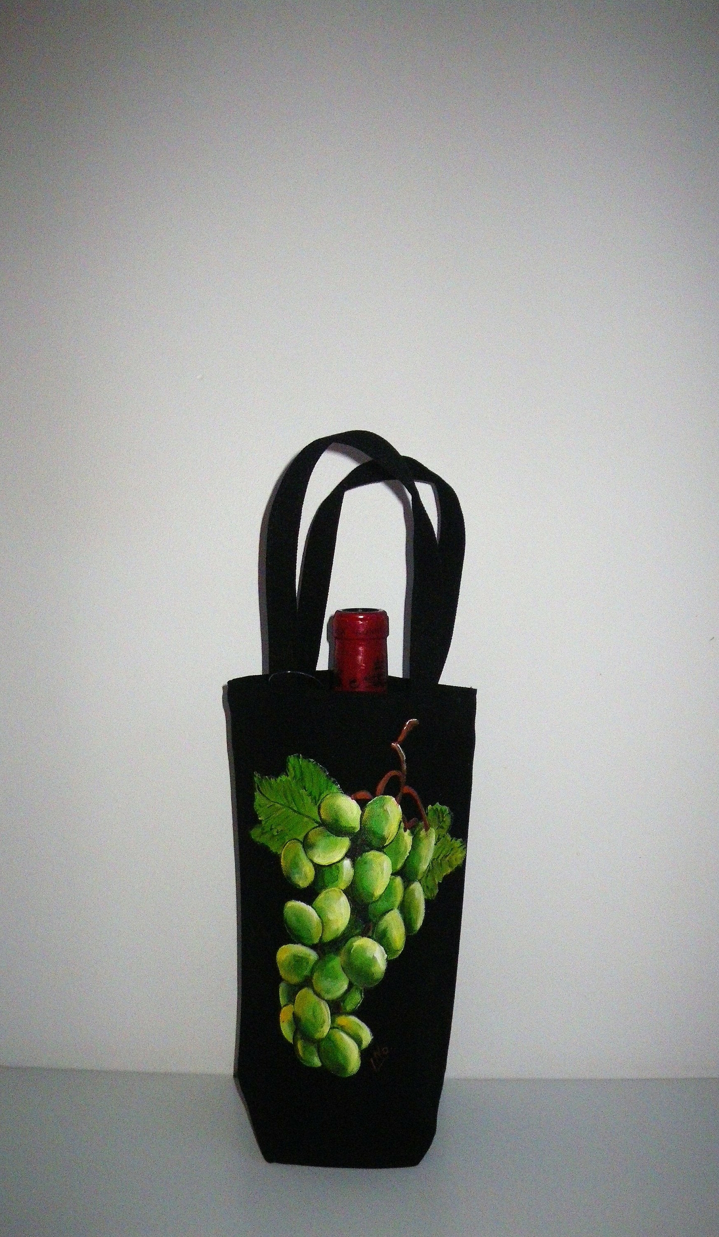 sac à bouteille avec grappe verte