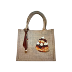 sac en jute avec une religieuse au chocolat peinte à la main par Elles et No.