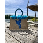 Sac de plage en jute avec des perroquets bleus peints à la main par Elles et No. et un boa en plumes collés sur le bord du sac