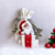 PPochette coton blanc, ruban satin gris, avec tête de père Noël peinte à la main par Elles et No.