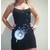 robe de plage noire avec fleur de pissenlit