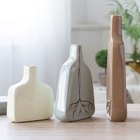 galerie glacis vases en céramique décorée de racines sur la table