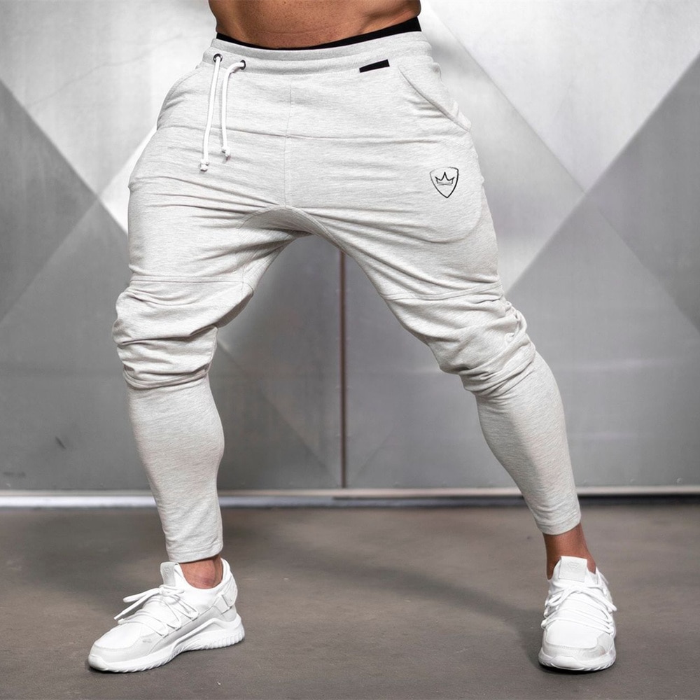 Coupe ajustée YAWHO Pantalon de jogging pour homme course à pied entraînement gym Pantalon de sport pour jogging entraînement avec poches zippées 