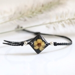 bracelet macramé coulissant réglable fleur séchée noir losange spirée