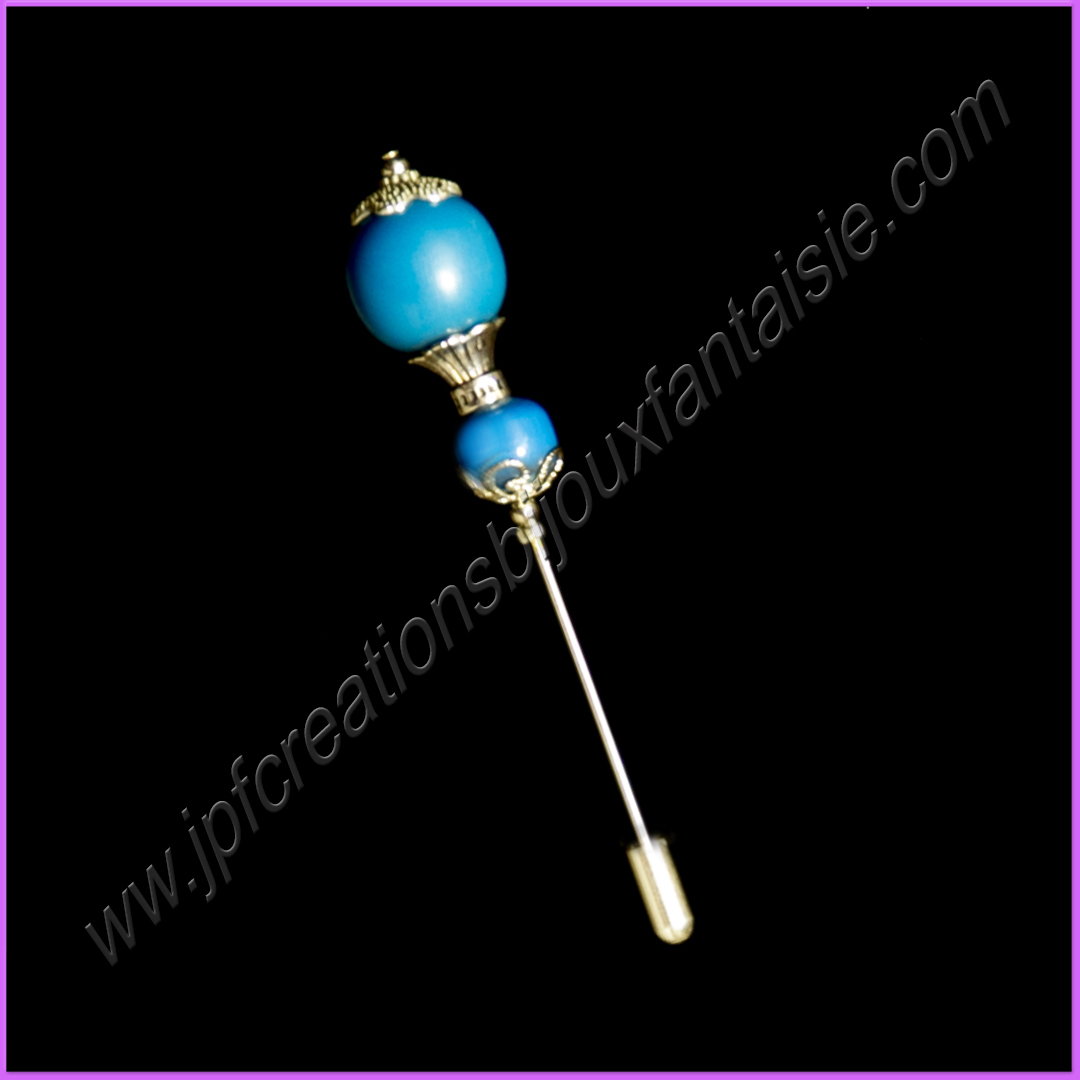 Broche métal argenté et perles bois peintes en bleu canard