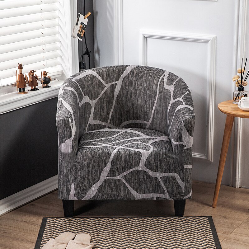 Housse de fauteuil extensible grise à motifs