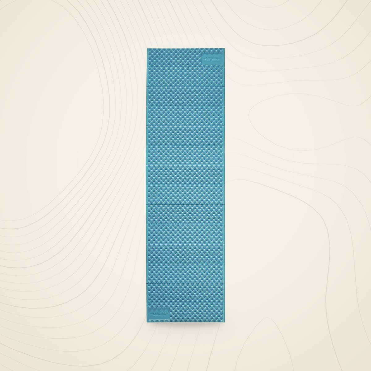 Matelas en mousse Therm-a-Rest Z Lite Sol déplié, face bleue alvéolée, sur fond lin