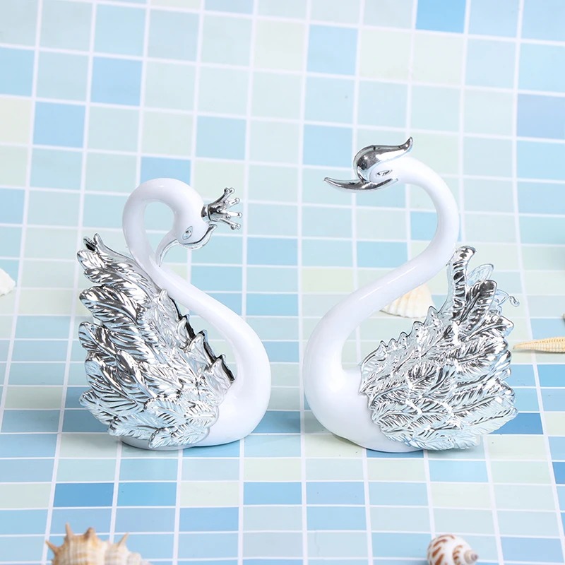 couple-de-cygnes-en-resine-couleur-argent