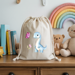 Sac pochon bébé personnalisable Dinosaure bleu émerveillé en coton avec flocage, cadeau naissance- MARJANE et Cie