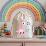 Sac pochon bébé personnalisé Dinosaure rose émerveillé en coton avec flocage couleur - MARJANE et Cie