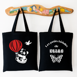Tote bag bébé personnalisé recto Voyage léger et verso prénom en coton noir avec flocage blanc - MARJANE et Cie