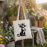 Tote bag chat femme verso noir suspendu à une chaise de jardin - MARJANE et Cie