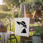 Tote bag femme portrait élégant au chapeau par flocage monochrome suspendu - MARJANE et Cie