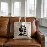 Tote bag femme avec message Back to Vintage en noir et blanc, flocage noir, posé sur un canapé - MARJANE et Cie