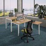 Fauteuil de bureau résille à assise vert acide dans un open space