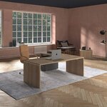 Bureau de direction en bois à pieds panneaux posé sur un tapis dans un bureau à parquet