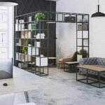 Grande étagère de séparation en arche en acier noir délimitant un coin détente dans un open space