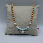 collier homme style surfeur pendentif oursin