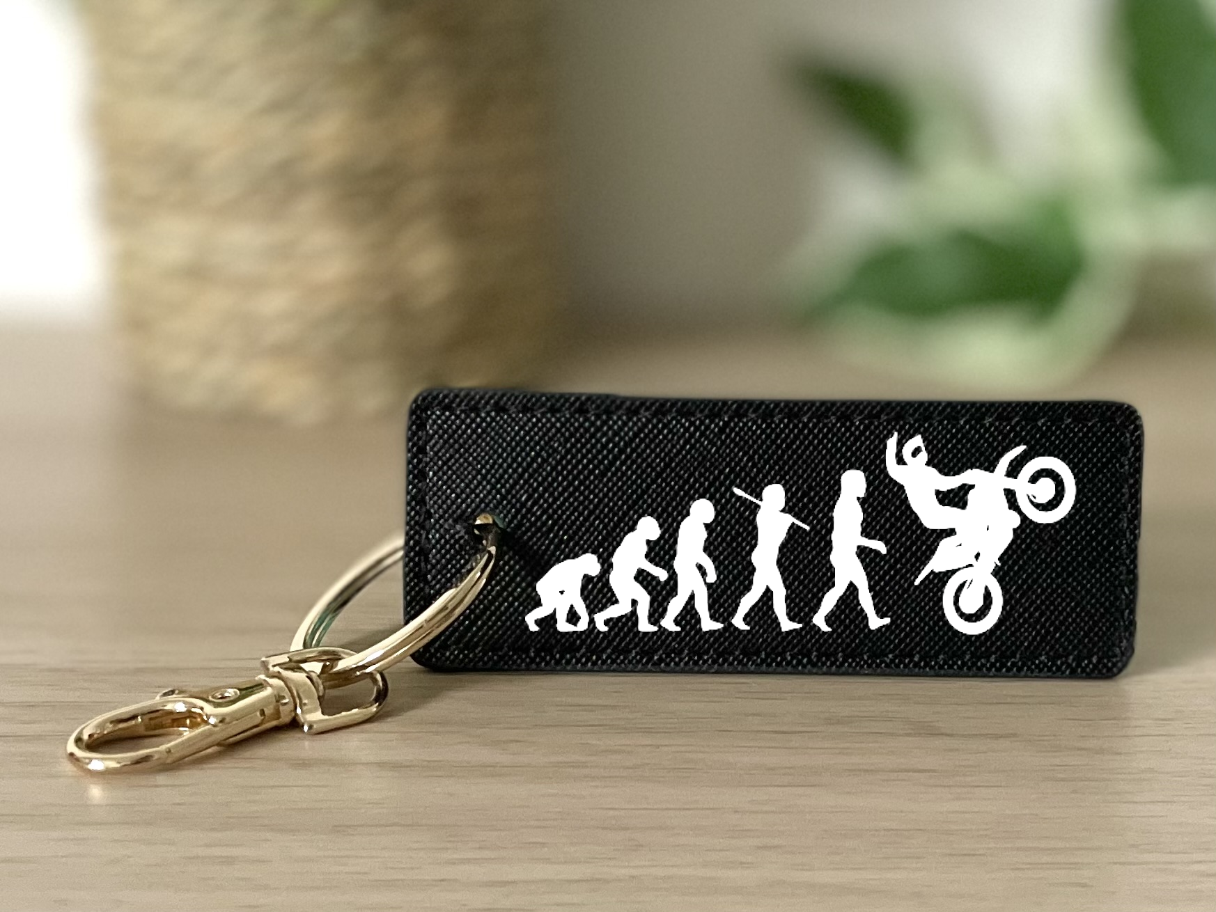 Porte clés évolution homme wheeling noir