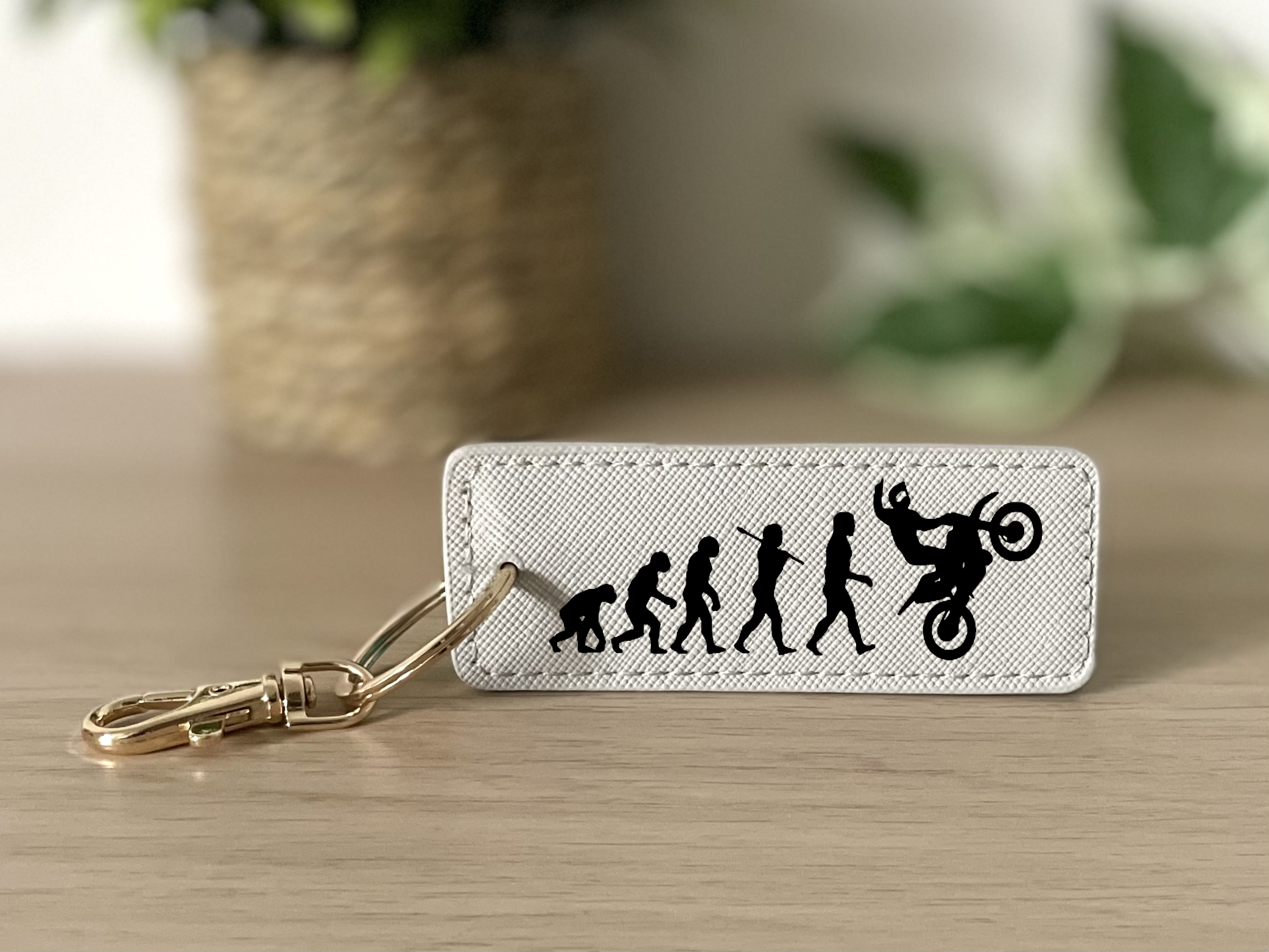 Porte clés évolution homme wheeling gris
