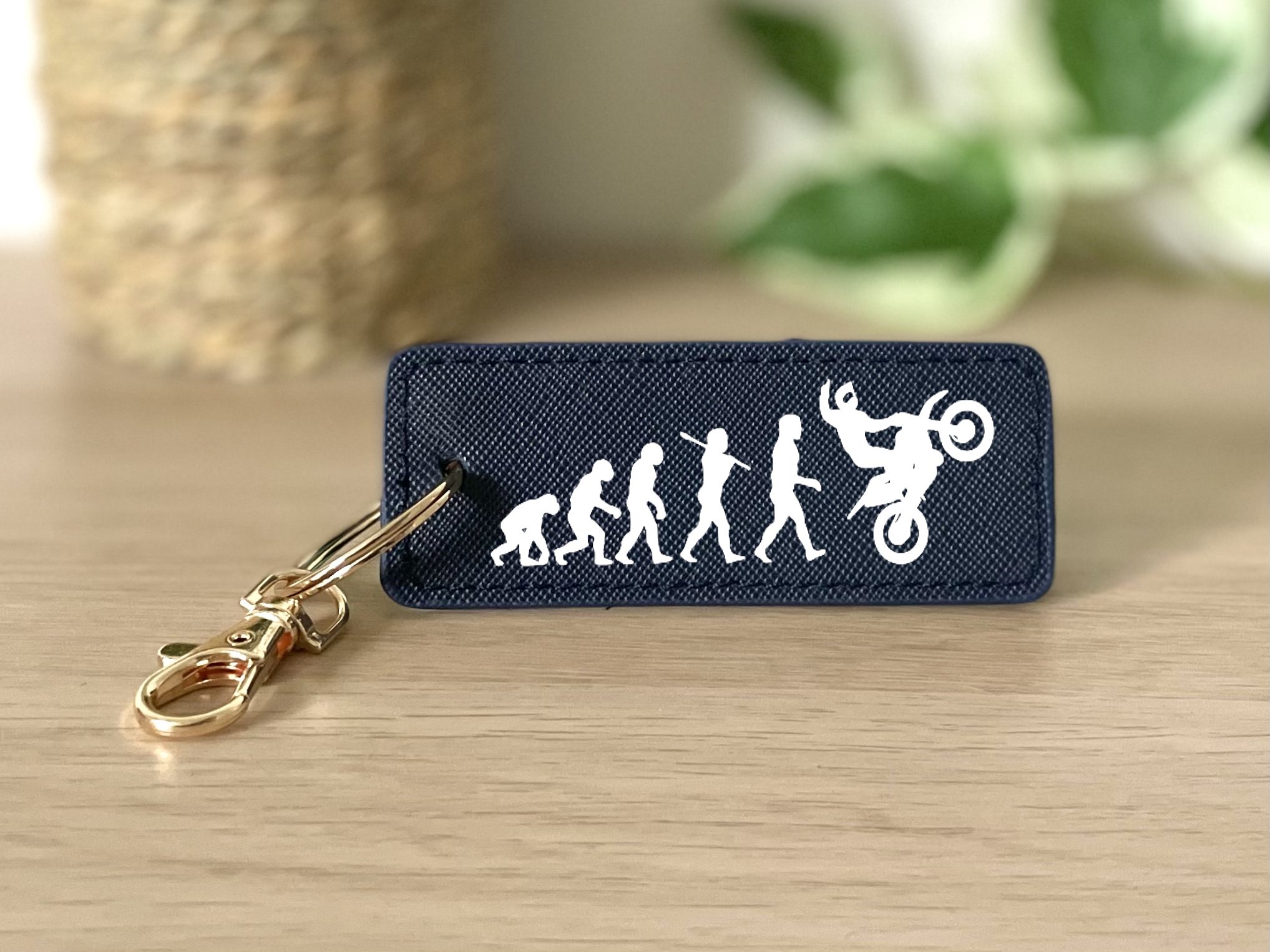 Porte clés évolution homme wheeling bleu