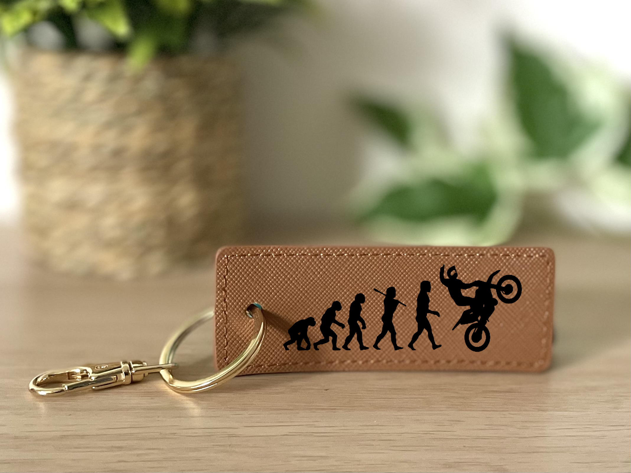 Porte clés évolution homme wheeling marron