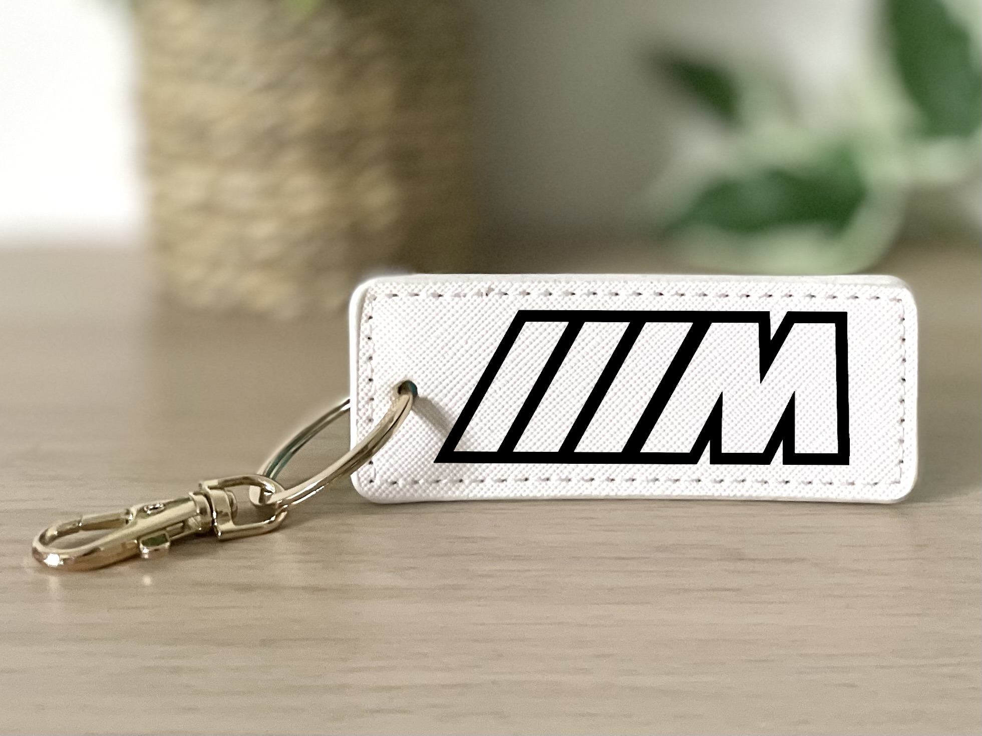 Porte clés M blanc
