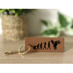 Porte clés évolution homme wheeling marron