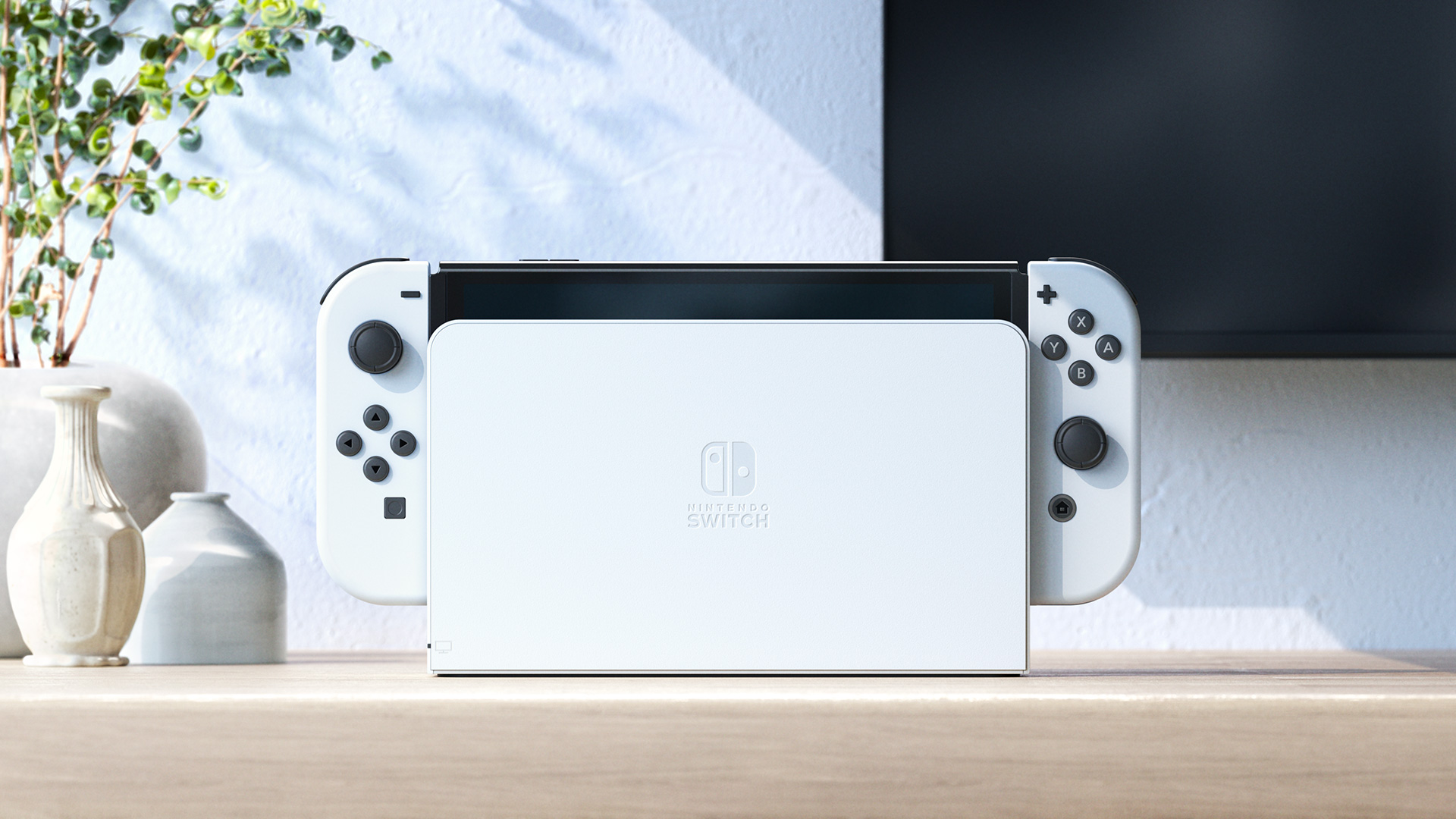 Console Nintendo Switch OLED et station d’accueil en mode téléviseur