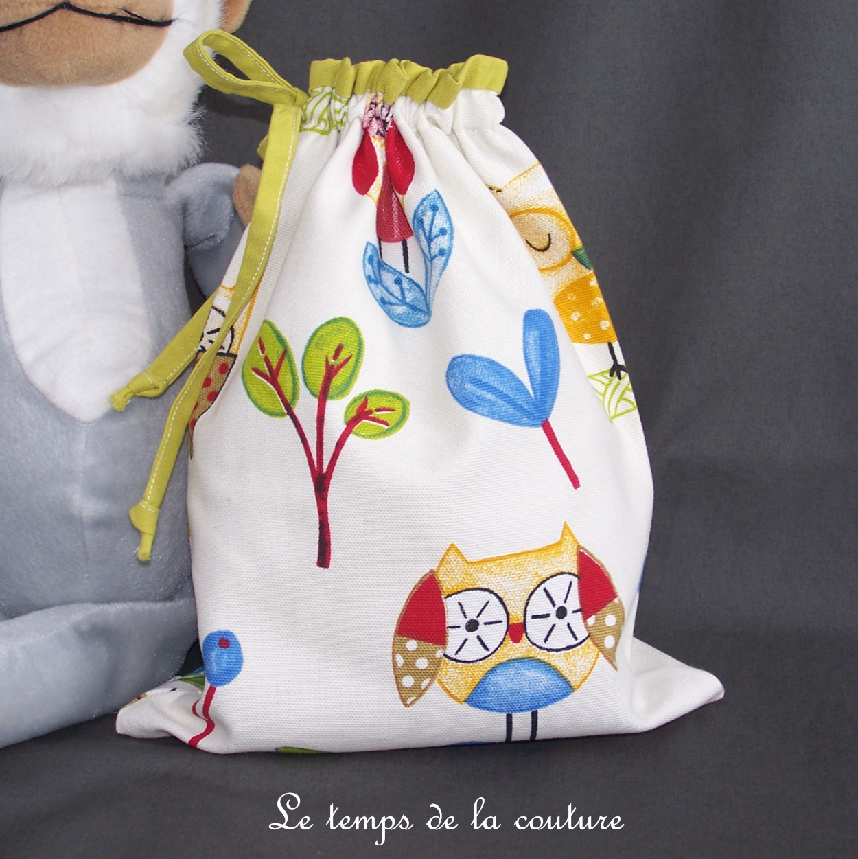 Sac pochon à doudou pour enfant motif chouette et hibou tons anis multicolore