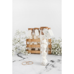 marshmallow-test-tube-with-blank-tag-wedding-rings-against-white-background