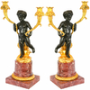 Paire de bougeoirs chérubins en bronze et marbre style Empire Iéna