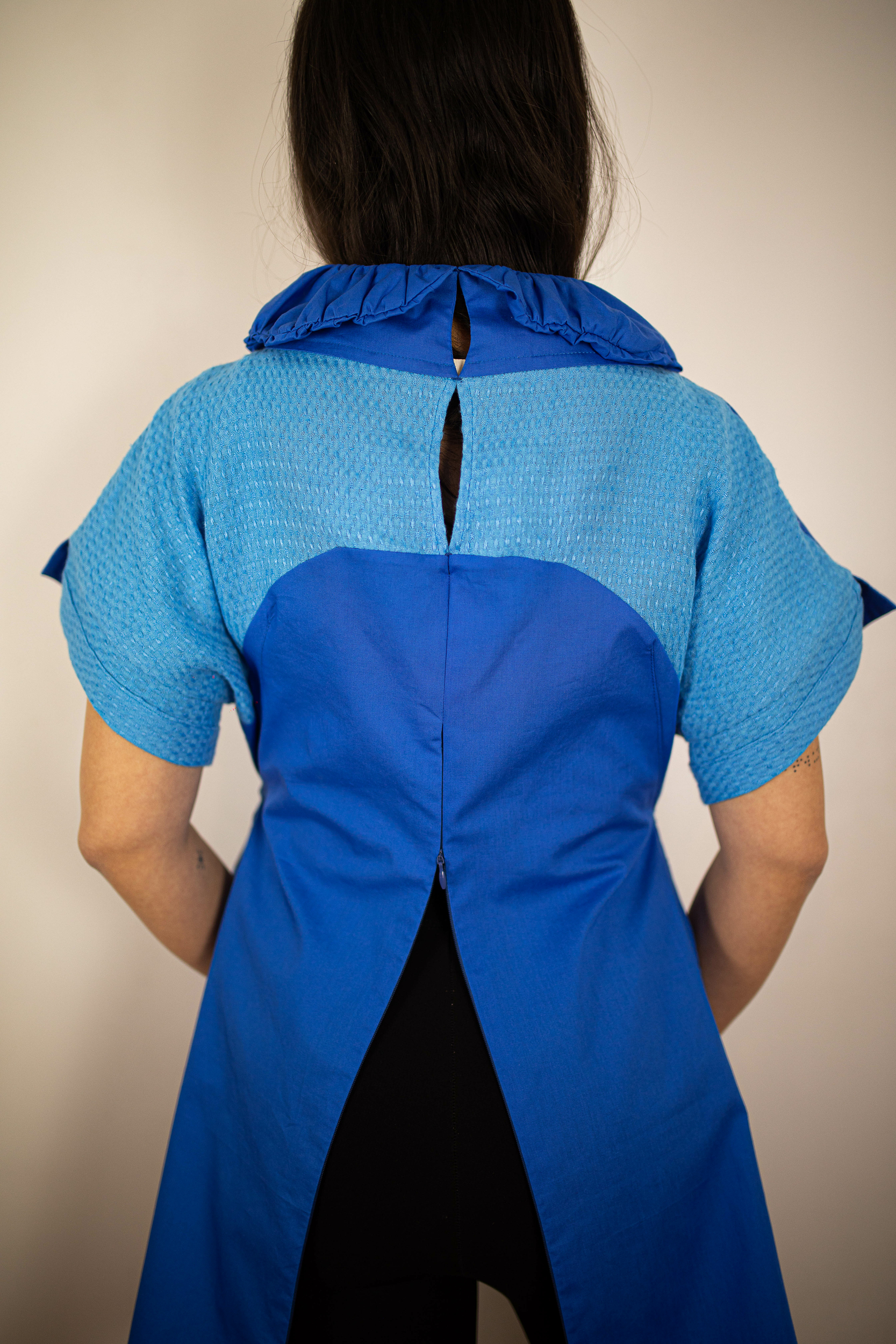 polo base bleu coton dos