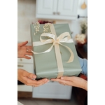 Person Holding Green and White Floral Gift Box