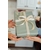 Person Holding Green and White Floral Gift Box