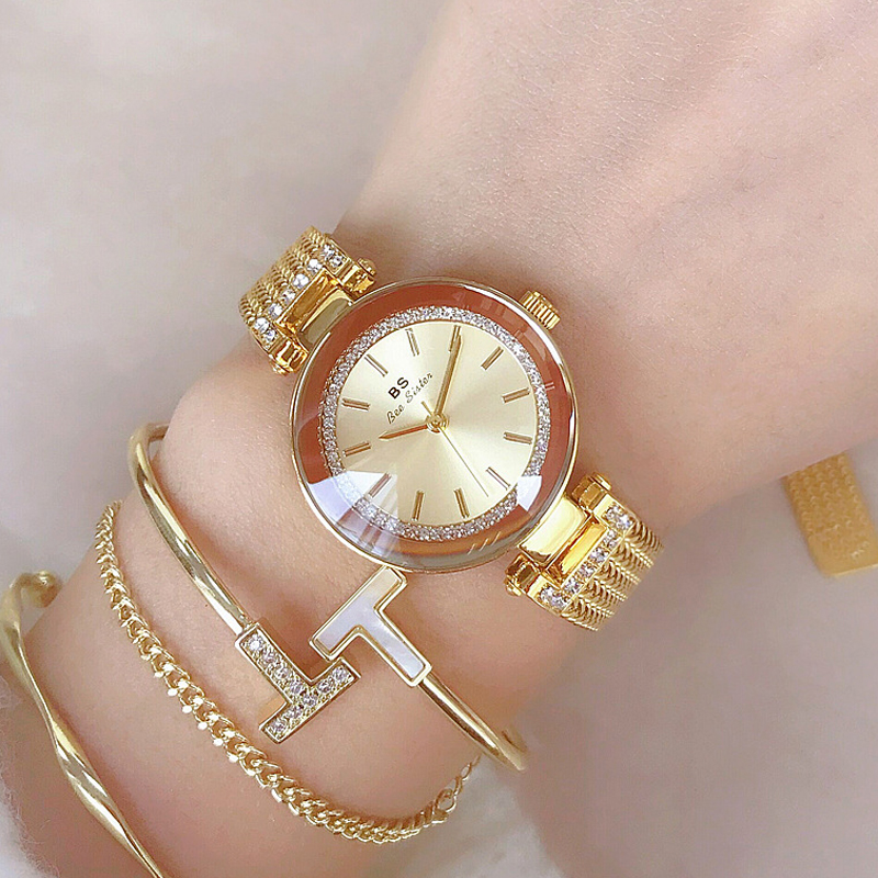 Promotion montre-bracelet femme, bracelet en maille dorée et zircon cubique.