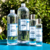 Flacons L’Hydrolat Equi Cosmétique en plusieurs formats, photographiés sur un fond végétal