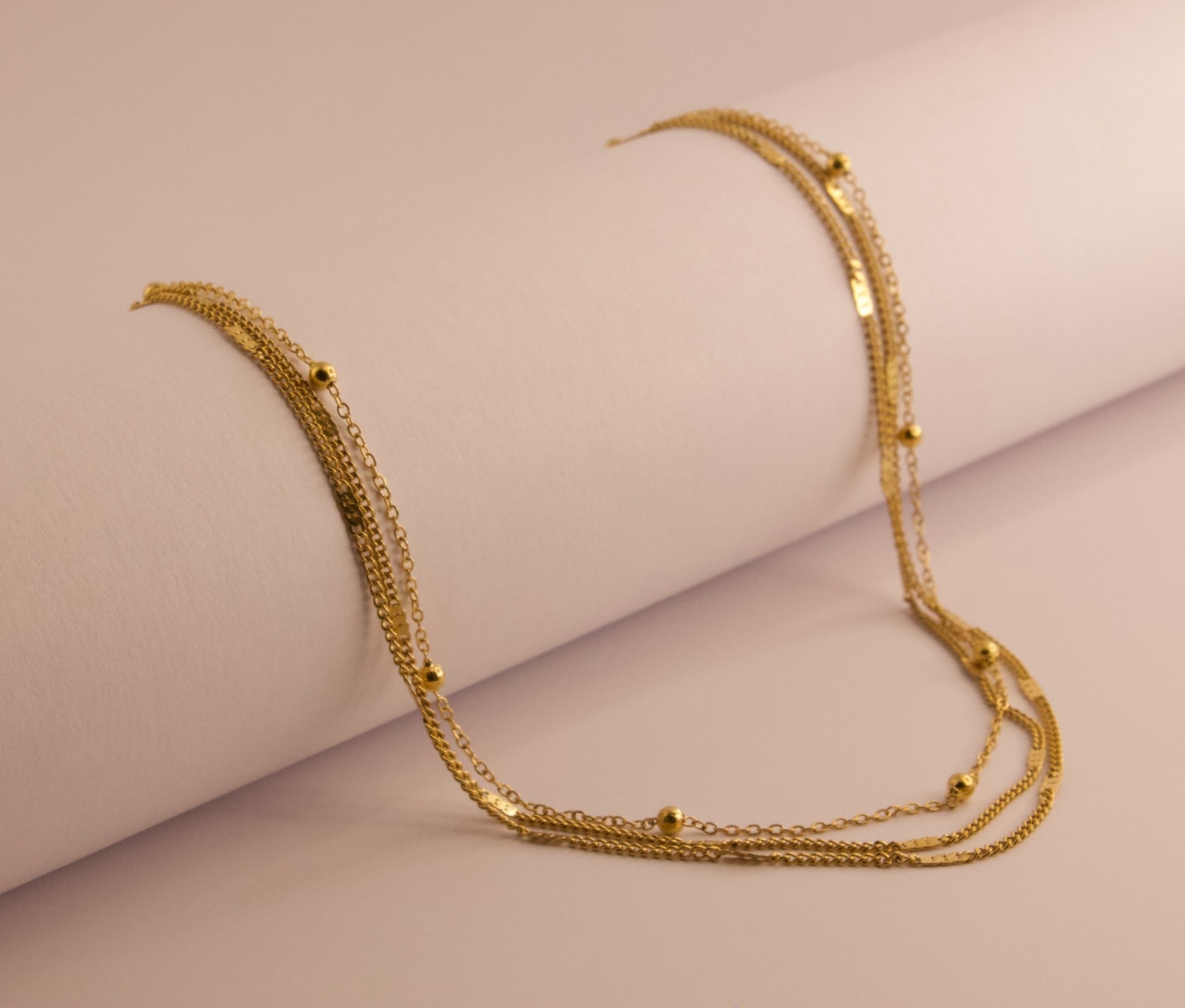 Collier triple en acier doré