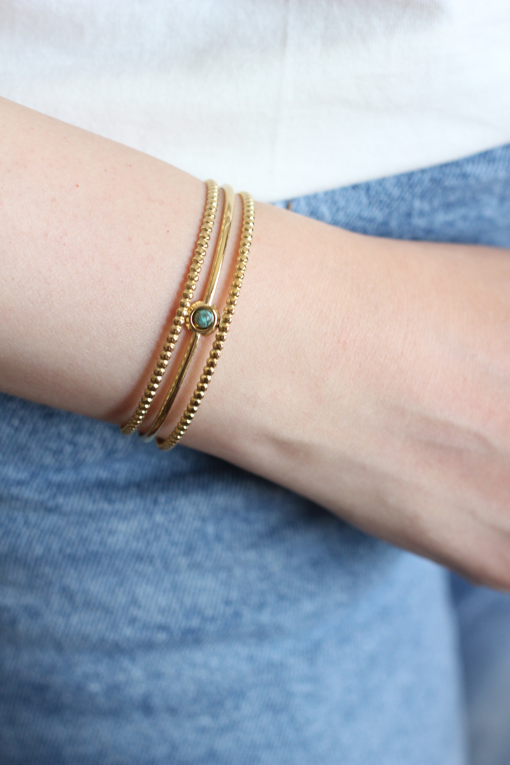 Bracelet jonc en acier doré et pin Africain