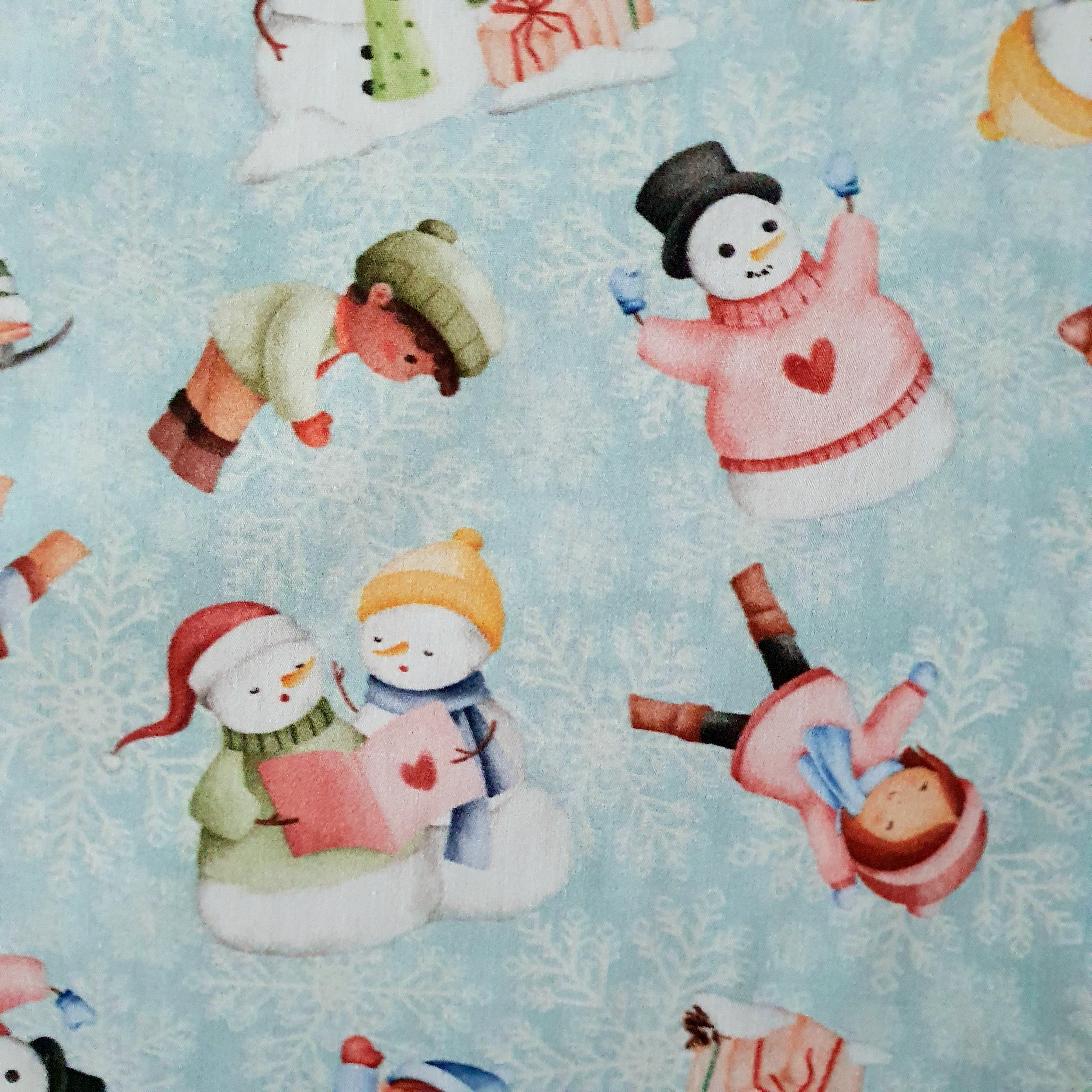 Tissu coton bio enfants et bonhomme de neige bleu ciel.