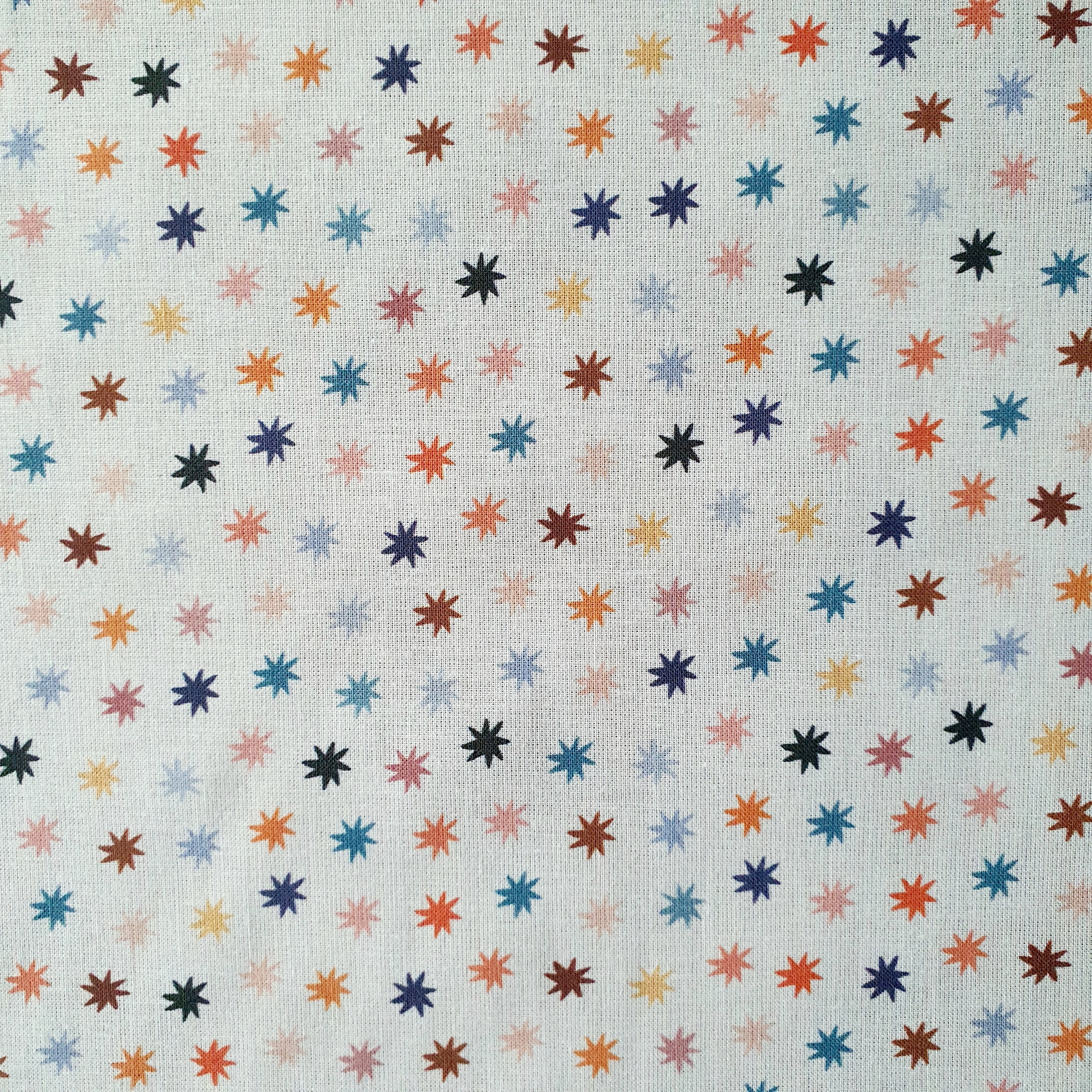 Tissu coton bio étoile multi couleur fond blanc