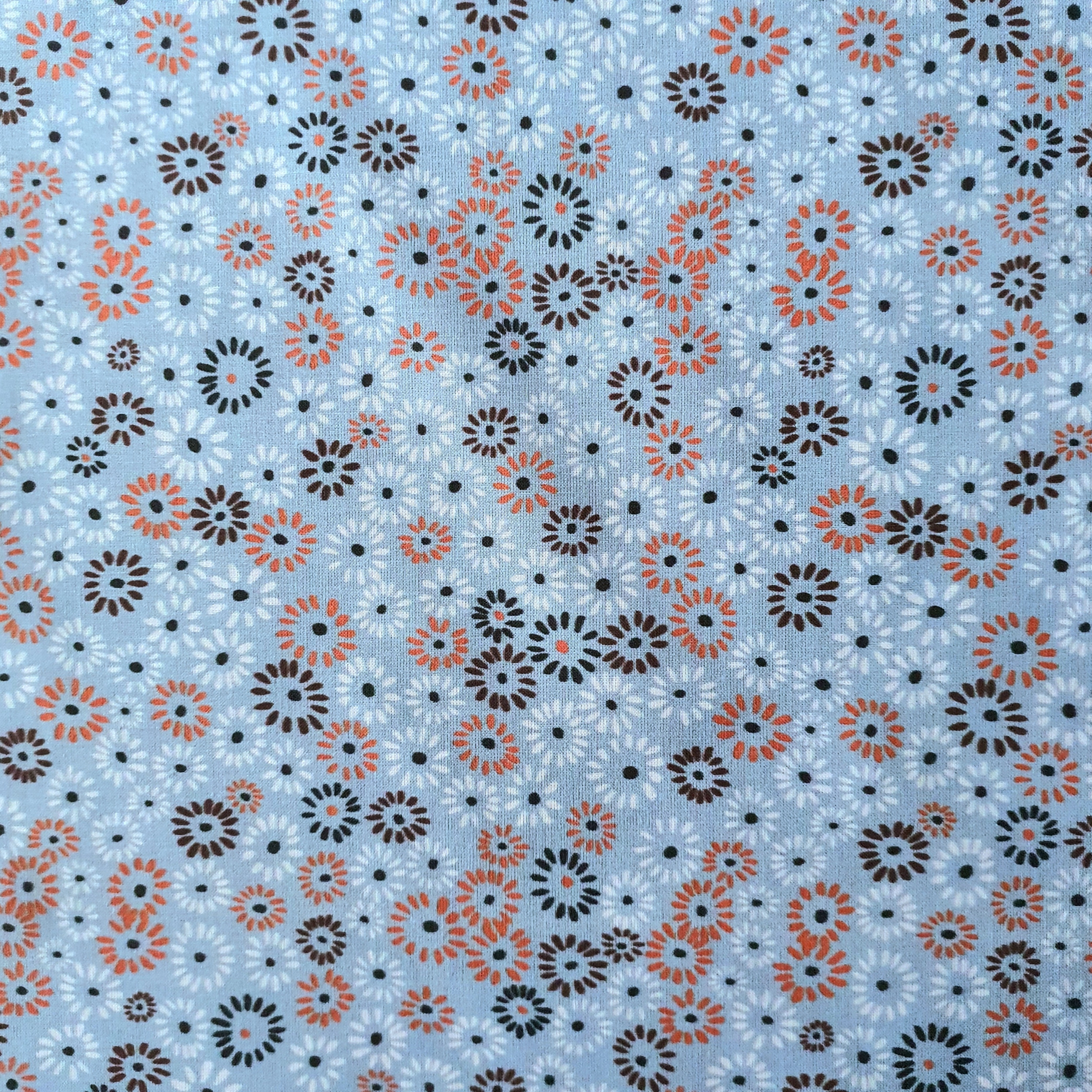 Tissu coton BIO fleur fond bleu ciel orange marron
